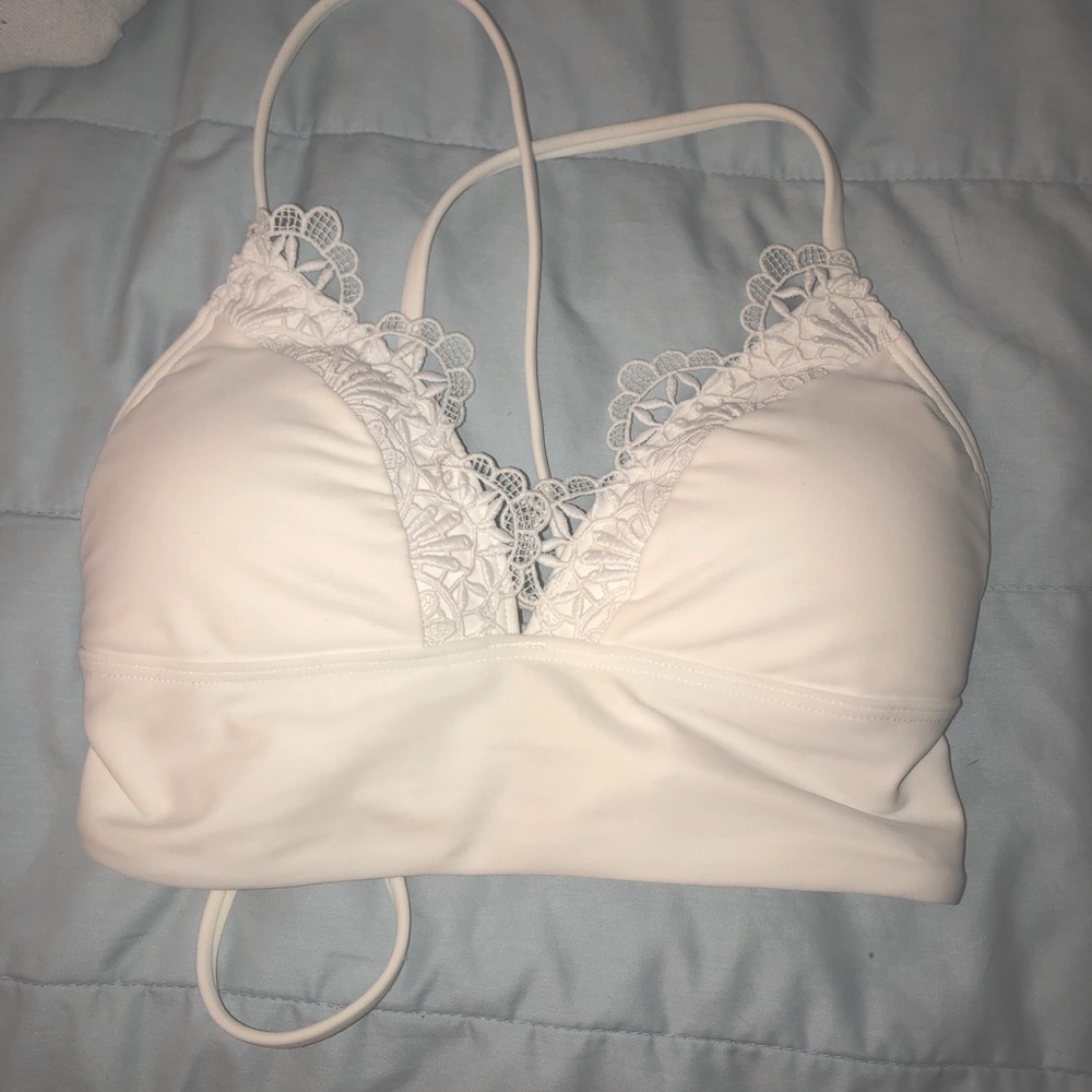 white hollister flower swimsuit top.